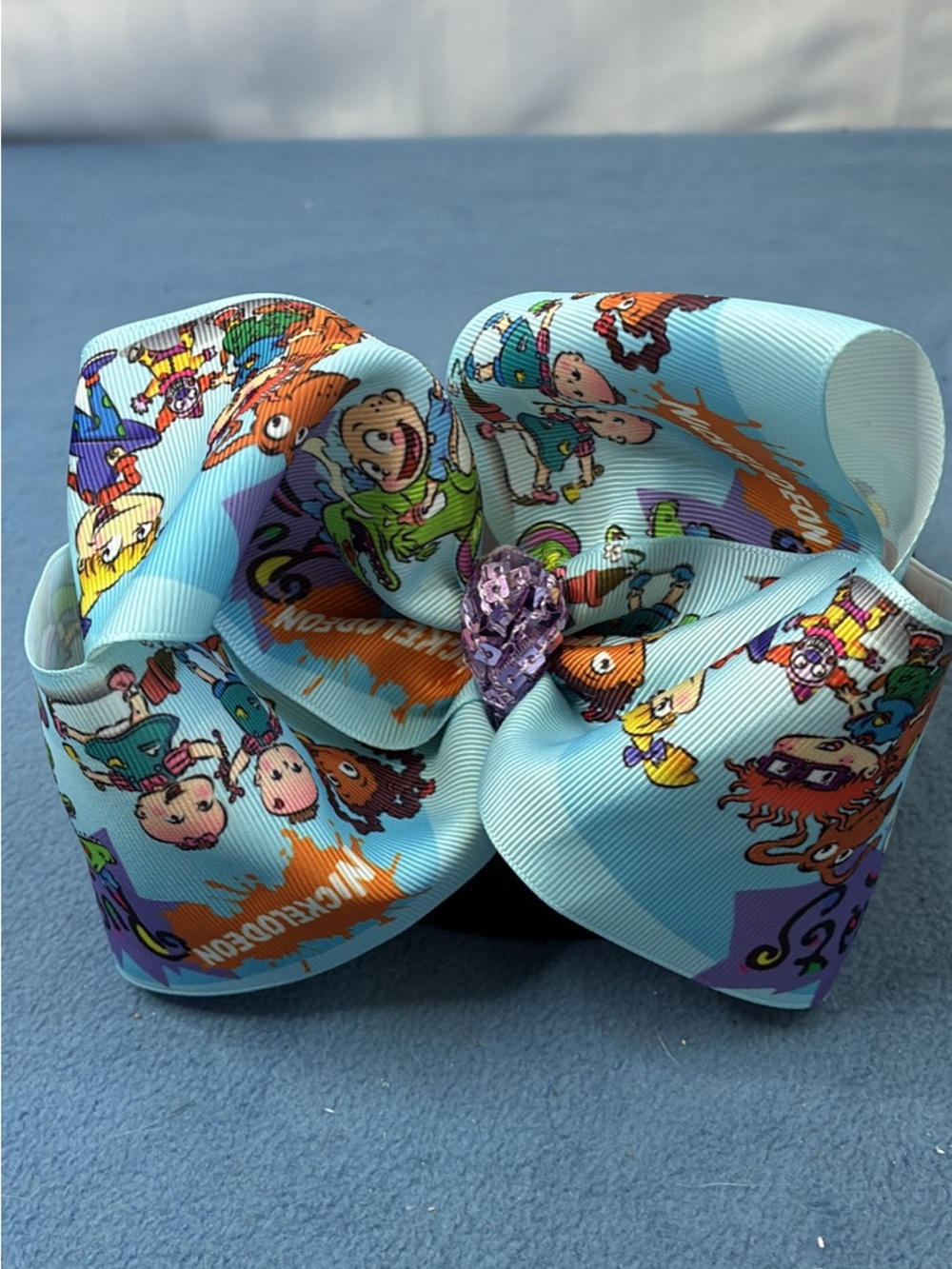 Nickelodeon Rugrats Print Light Blue Hair Bow with Purple Gem
